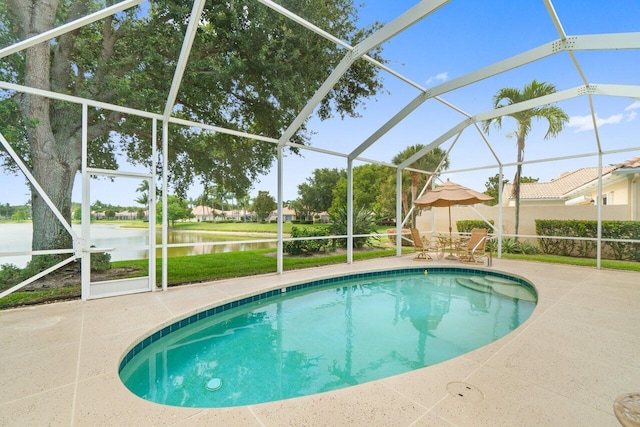 843 Niemen Dr, Palm Beach Gardens, FL 33410 - view of swimming pool featuring a patio area, a water view, and glass enclosure