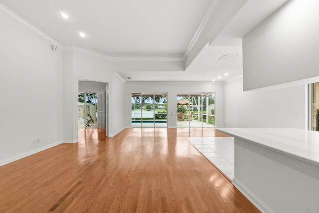 843 Niemen Dr, Palm Beach Gardens, FL 33410 - unfurnished living room with ornamental molding, recessed lighting, light wood-type flooring, and baseboards