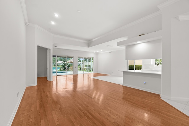 843 Niemen Dr, Palm Beach Gardens, FL 33410 - unfurnished living room featuring crown molding, light wood-style floors, recessed lighting, and baseboards