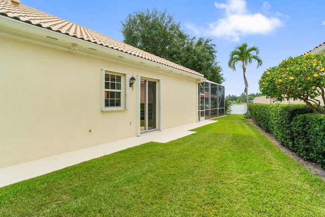 843 Niemen Dr, Palm Beach Gardens, FL 33410 - view of green lawn with a lanai