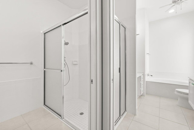 843 Niemen Dr, Palm Beach Gardens, FL 33410 - bathroom featuring a shower stall, a garden tub, tile patterned floors, toilet, and ceiling fan