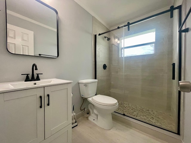 4491 NW 1st Ter, Deerfield Beach, FL 33064 - bathroom featuring ornamental molding, toilet, vanity, a shower stall, and wood finished floors