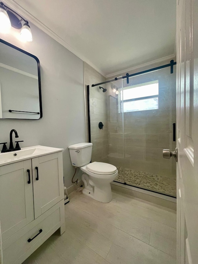 4491 NW 1st Ter, Deerfield Beach, FL 33064 - full bathroom featuring ornamental molding, toilet, vanity, a stall shower, and baseboards