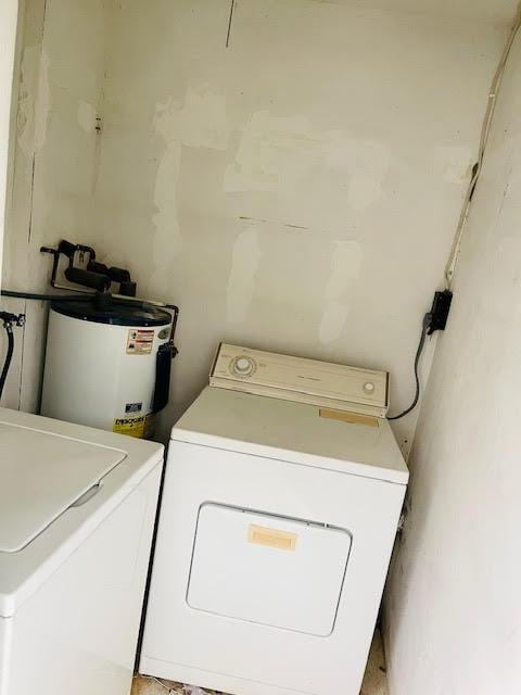 4491 NW 1st Ter, Deerfield Beach, FL 33064 - laundry room featuring water heater and washing machine and clothes dryer