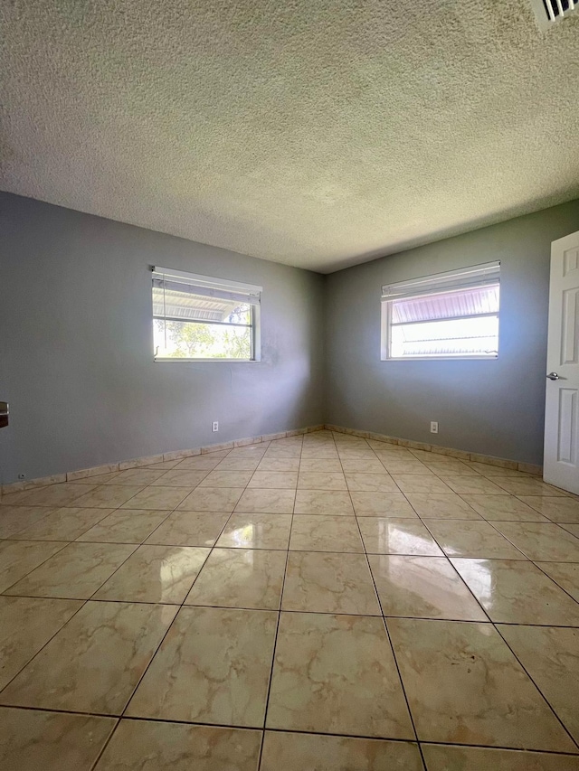 4491 NW 1st Ter, Deerfield Beach, FL 33064 - spare room with a textured ceiling
