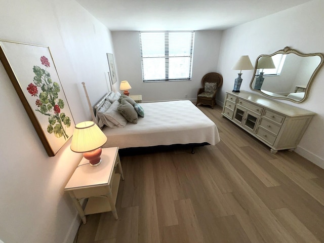 2860 S Ocean Blvd Unit 415, Palm Beach, FL 33480 - bedroom featuring wood finished floors and baseboards