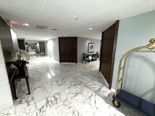 2860 S Ocean Blvd Unit 415, Palm Beach, FL 33480 - hall with marble finish floors, a paneled ceiling, and baseboards