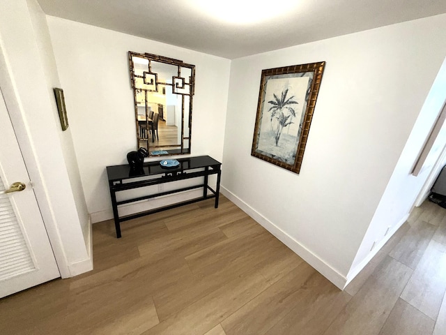 2860 S Ocean Blvd Unit 415, Palm Beach, FL 33480 - corridor with wood finished floors and baseboards