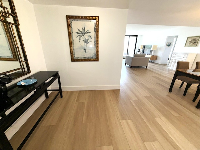 2860 S Ocean Blvd Unit 415, Palm Beach, FL 33480 - corridor with light wood-type flooring and baseboards