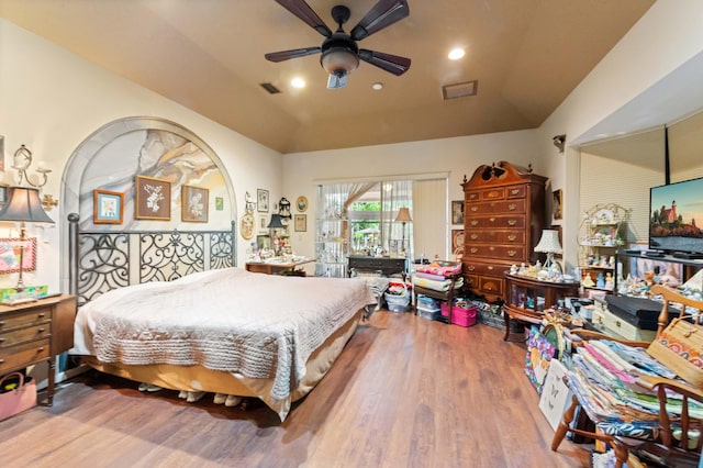 6935 Pioneer Rd, West Palm Beach, FL 33413 - bedroom with wood finished floors, vaulted ceiling, a ceiling fan, and recessed lighting