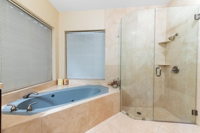 6935 Pioneer Rd, West Palm Beach, FL 33413 - full bath featuring a jetted tub, a stall shower, and tile patterned floors
