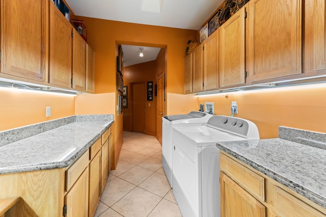 6935 Pioneer Rd, West Palm Beach, FL 33413 - laundry room with cabinet space, washing machine and dryer, and light tile patterned floors