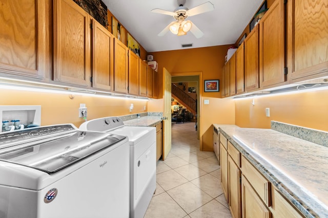 6935 Pioneer Rd, West Palm Beach, FL 33413 - washroom featuring cabinet space, separate washer and dryer, a ceiling fan, and light tile patterned floors