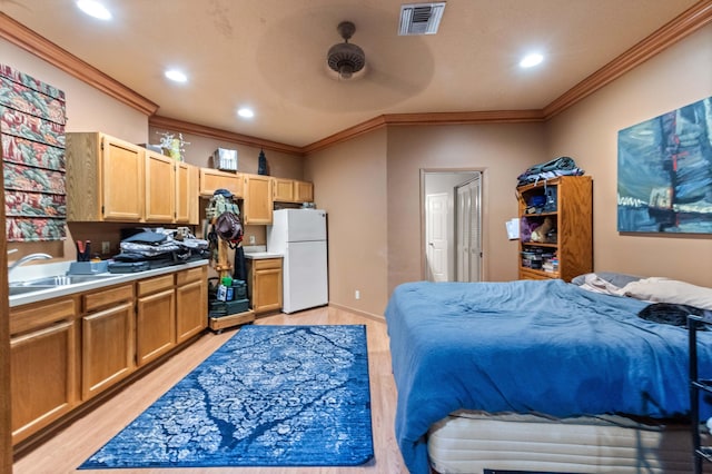 6935 Pioneer Rd, West Palm Beach, FL 33413 - bedroom with freestanding refrigerator, light wood-style floors, crown molding, and recessed lighting
