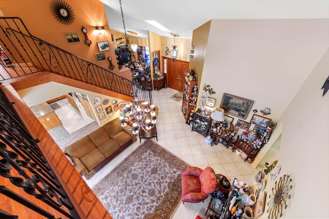 6935 Pioneer Rd, West Palm Beach, FL 33413 - tiled living room with a chandelier and stairs