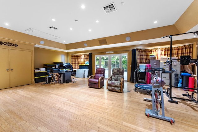 6935 Pioneer Rd, West Palm Beach, FL 33413 - exercise room featuring wood finished floors and recessed lighting