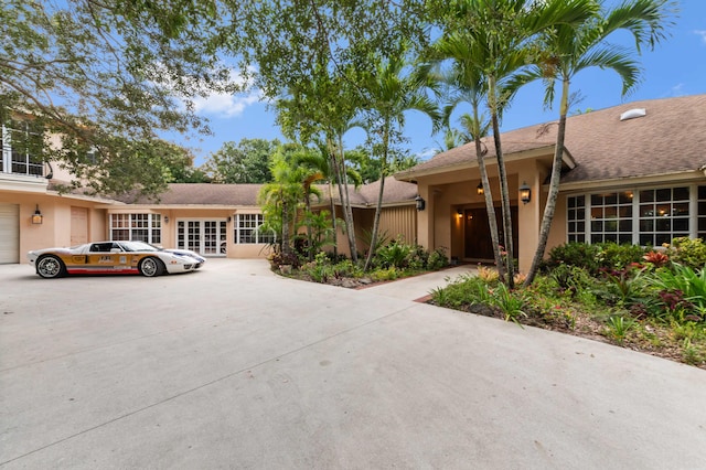 6935 Pioneer Rd, West Palm Beach, FL 33413 - view of front of house with concrete driveway and an attached garage