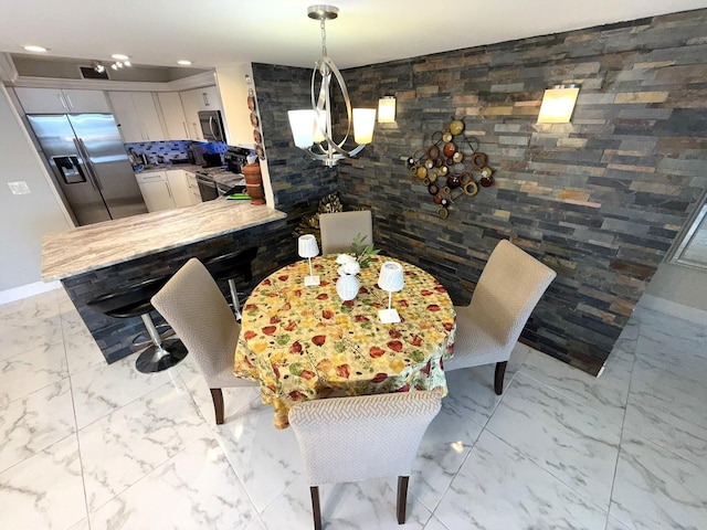 2425 Presidential Way Unit 1804, West Palm Beach, FL 33401 - dining room with marble look tiles, baseboards, a chandelier, and recessed lighting