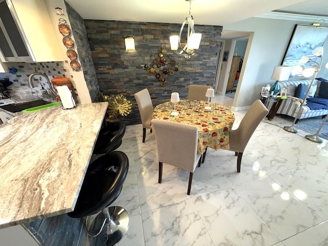 2425 Presidential Way Unit 1804, West Palm Beach, FL 33401 - dining space with light marble finish flooring, a chandelier, and crown molding