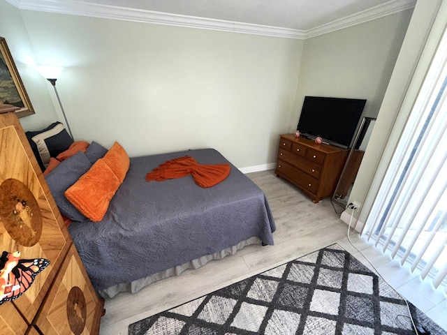 2425 Presidential Way Unit 1804, West Palm Beach, FL 33401 - bedroom with crown molding, baseboards, and light wood-type flooring