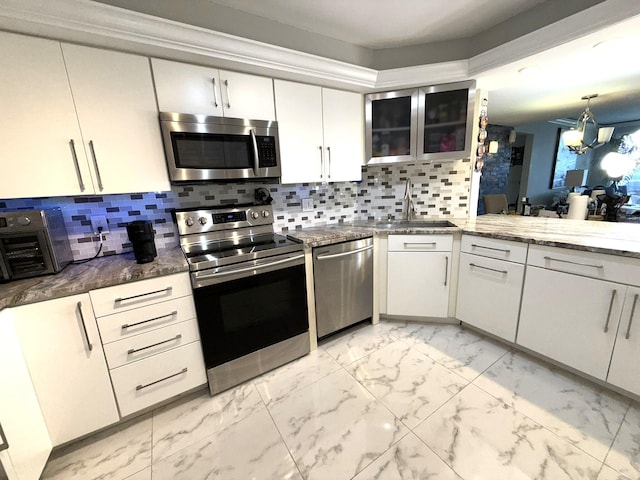2425 Presidential Way Unit 1804, West Palm Beach, FL 33401 - kitchen with stainless steel appliances, light marble finish flooring, a chandelier, and a sink