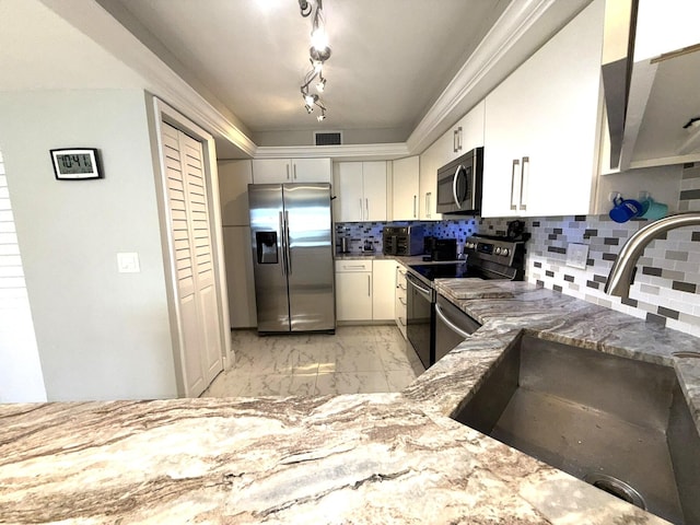 2425 Presidential Way Unit 1804, West Palm Beach, FL 33401 - kitchen featuring stainless steel appliances, a sink, light marble finish floors, light stone countertops, and white cabinets