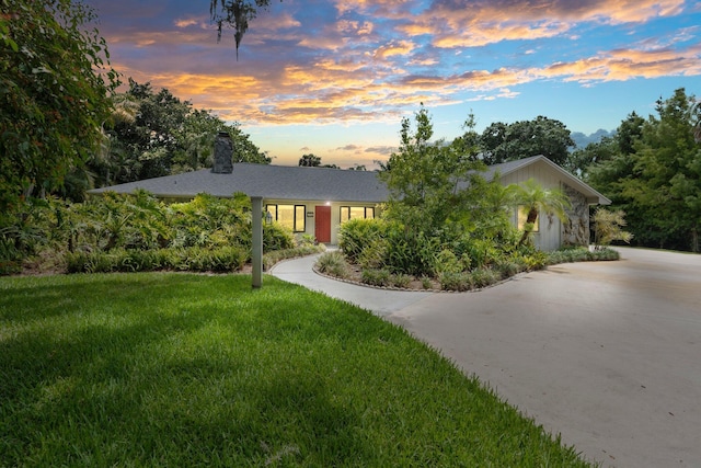 4904 River Pl, Fort Pierce, FL 34982 - ranch-style house with a chimney and a yard
