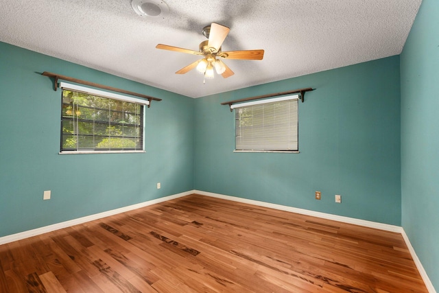 4904 River Pl, Fort Pierce, FL 34982 - unfurnished room featuring a ceiling fan, wood finished floors, baseboards, and a textured ceiling