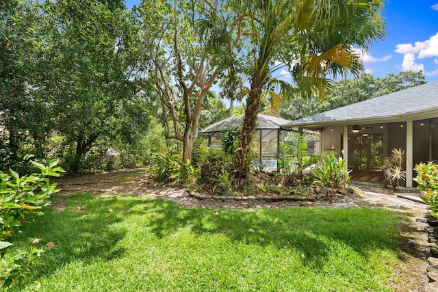 4904 River Pl, Fort Pierce, FL 34982 - view of grassy yard with glass enclosure