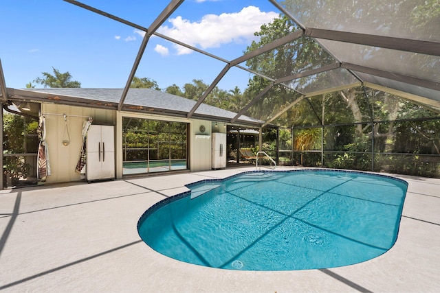 4904 River Pl, Fort Pierce, FL 34982 - swimming pool with a patio and glass enclosure