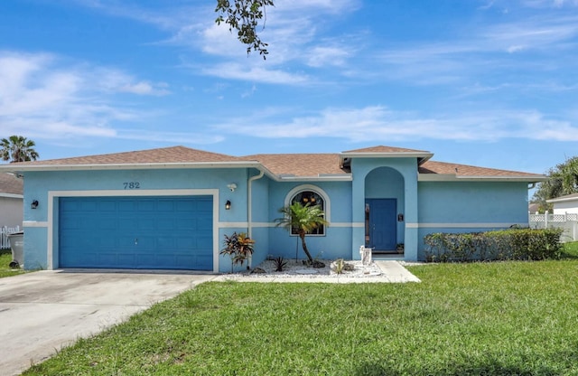 782 NW 16th Pl, Pompano Beach, FL 33060 - ranch-style house featuring stucco siding, driveway, a garage, and a front lawn