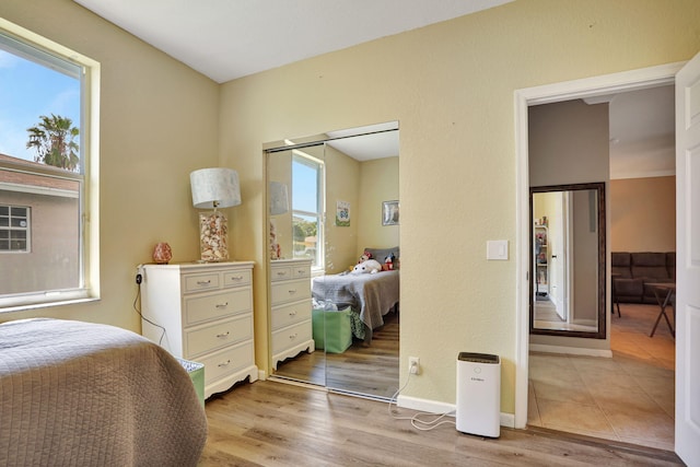 782 NW 16th Pl, Pompano Beach, FL 33060 - bedroom featuring a closet and light wood-style floors