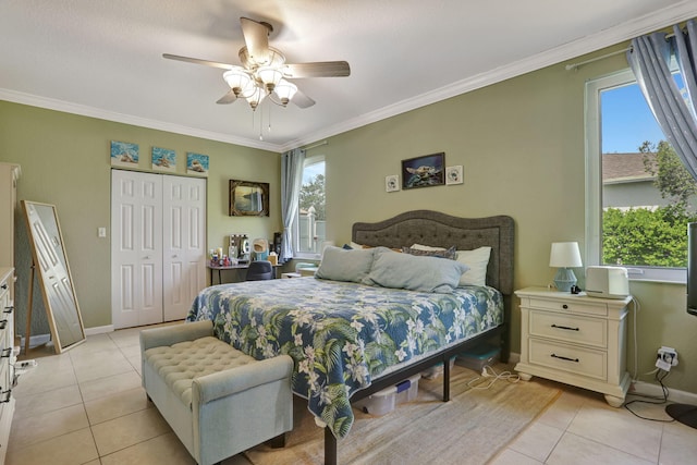 782 NW 16th Pl, Pompano Beach, FL 33060 - bedroom with light tile patterned flooring, ornamental molding, a closet, and ceiling fan