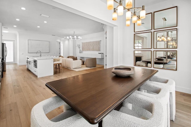 4689 Hammock Cir, Delray Beach, FL 33445 - dining space with a chandelier, recessed lighting, light wood-type flooring, and baseboards