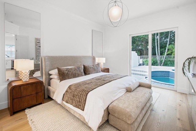 4689 Hammock Cir, Delray Beach, FL 33445 - bedroom with access to outside, light wood-style floors, and ornamental molding