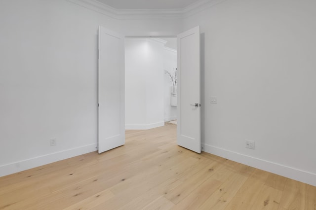 4689 Hammock Cir, Delray Beach, FL 33445 - spare room featuring crown molding, baseboards, and wood finished floors