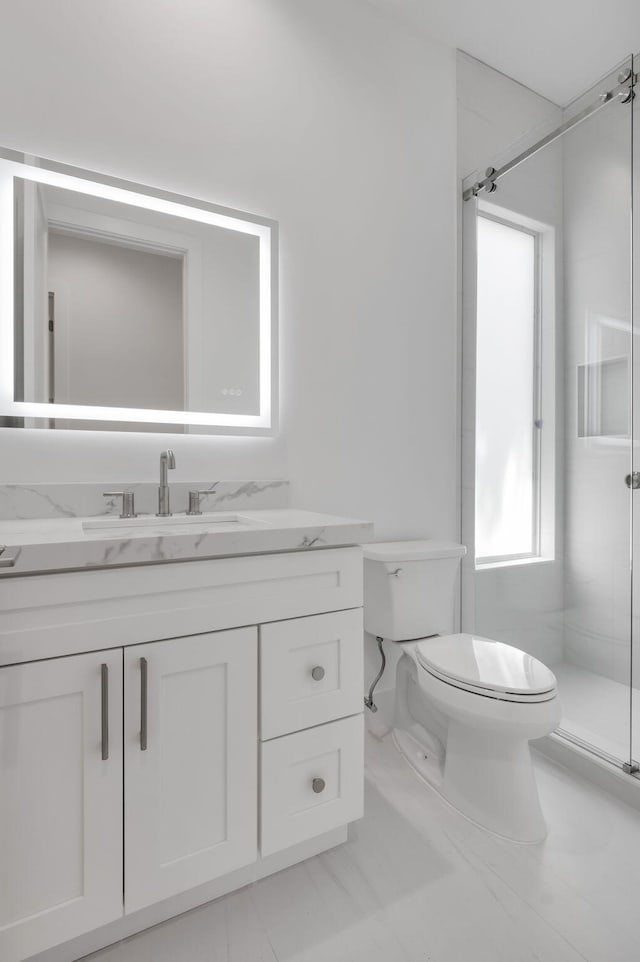 4689 Hammock Cir, Delray Beach, FL 33445 - full bath with toilet, vanity, a shower stall, and marble look tile flooring