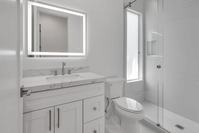4689 Hammock Cir, Delray Beach, FL 33445 - full bathroom featuring vanity, toilet, and a stall shower