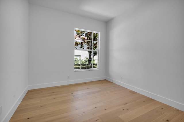 4689 Hammock Cir, Delray Beach, FL 33445 - unfurnished room with light wood finished floors and baseboards