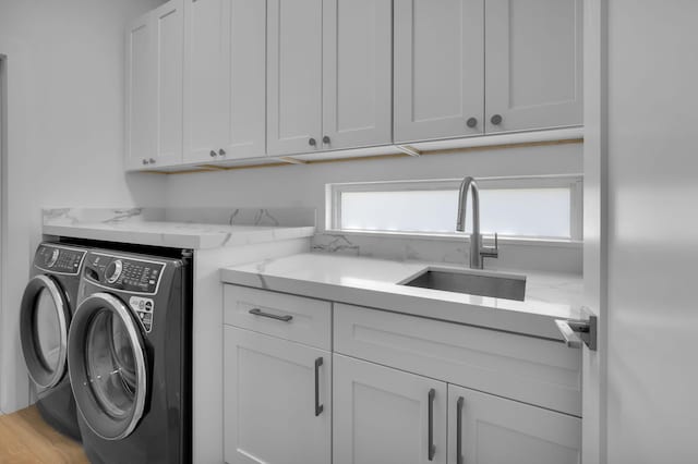 4689 Hammock Cir, Delray Beach, FL 33445 - laundry area featuring cabinet space and independent washer and dryer