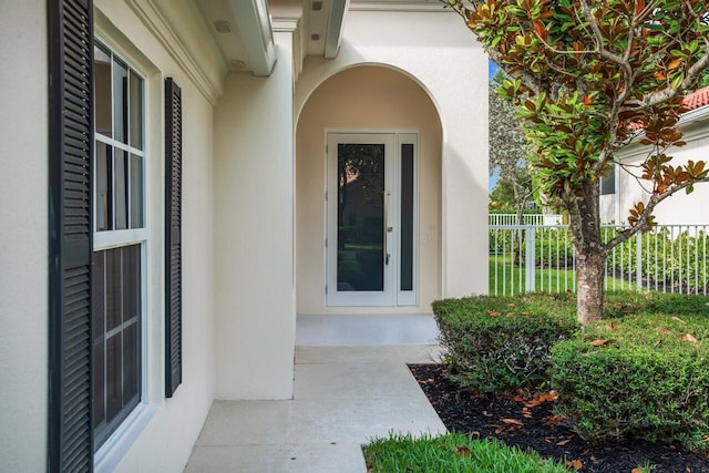4689 Hammock Cir, Delray Beach, FL 33445 - view of exterior entry with stucco siding