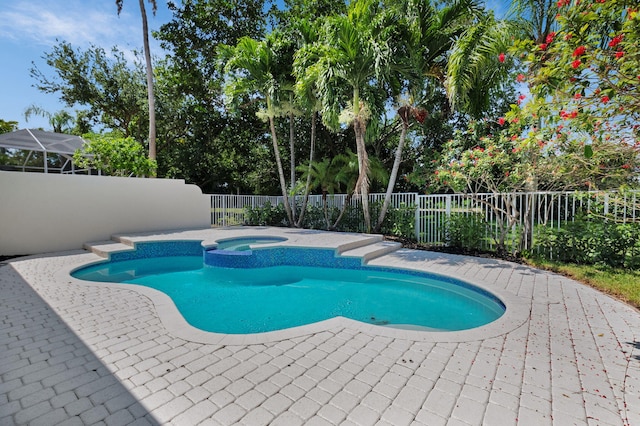 4689 Hammock Cir, Delray Beach, FL 33445 - view of swimming pool featuring a fenced backyard, a patio, and a pool with connected hot tub