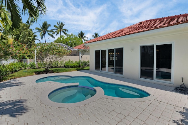 4689 Hammock Cir, Delray Beach, FL 33445 - view of pool with a patio area and a pool with connected hot tub