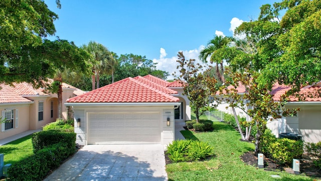 4689 Hammock Cir, Delray Beach, FL 33445 - mediterranean / spanish-style home featuring a tile roof, stucco siding, concrete driveway, and an attached garage