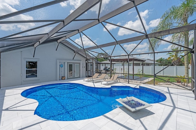 2471 SE Leithgow St, Port Saint Lucie, FL 34952 - view of swimming pool featuring french doors, a patio, and glass enclosure