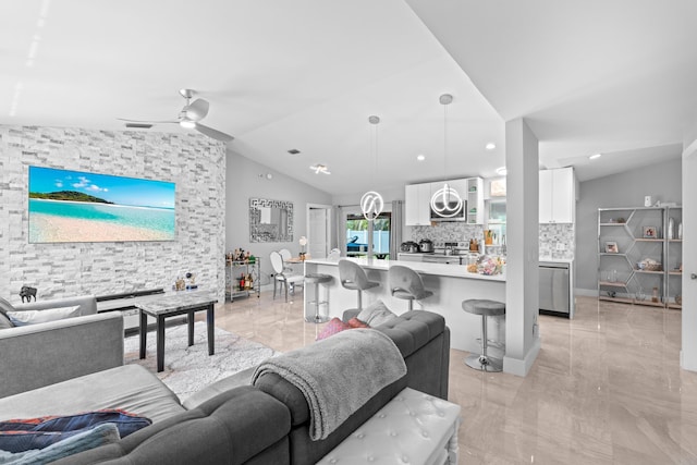 2471 SE Leithgow St, Port Saint Lucie, FL 34952 - living area featuring vaulted ceiling, light marble finish flooring, and ceiling fan