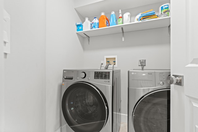 2471 SE Leithgow St, Port Saint Lucie, FL 34952 - washroom with washing machine and dryer