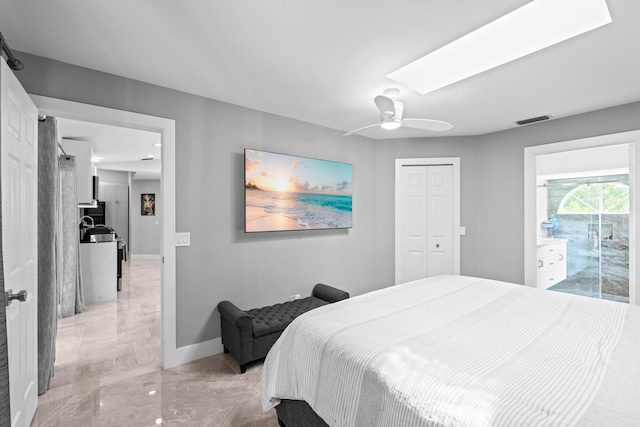 2471 SE Leithgow St, Port Saint Lucie, FL 34952 - bedroom featuring light marble finish floors, a closet, a ceiling fan, and baseboards