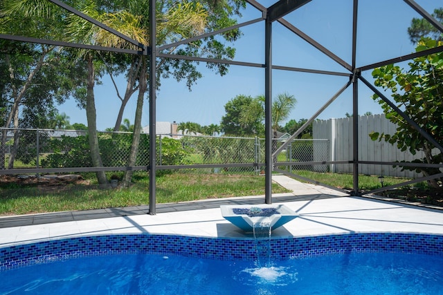 2471 SE Leithgow St, Port Saint Lucie, FL 34952 - view of swimming pool featuring a lanai and a fenced backyard