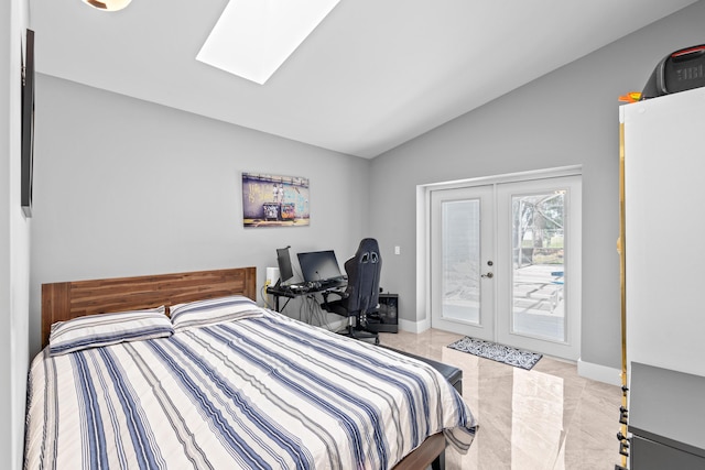 2471 SE Leithgow St, Port Saint Lucie, FL 34952 - bedroom with vaulted ceiling, french doors, access to exterior, a skylight, and baseboards